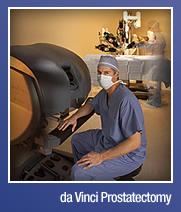 surgeon seated next to a da Vinci surigical robot in an operating room